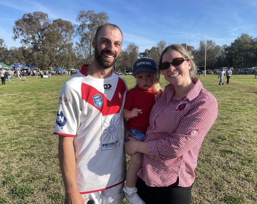 Will, Frankie and Tash Petrie share a moment at full-time in the grand final. Picture by Dominic Unwin