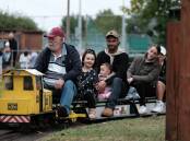 Evie, Marley, and Aaron and Samantha Tavraki enjoyed a ride on the miniature trains. Picture by James Arrow.