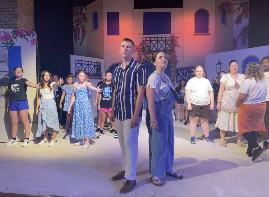 The cast of Mamma Mia with Jake Henry in the role of Sam Carmichael, alongside Olivia Brabham in the role of Donna Sheridan. Picture by Alise McIntosh