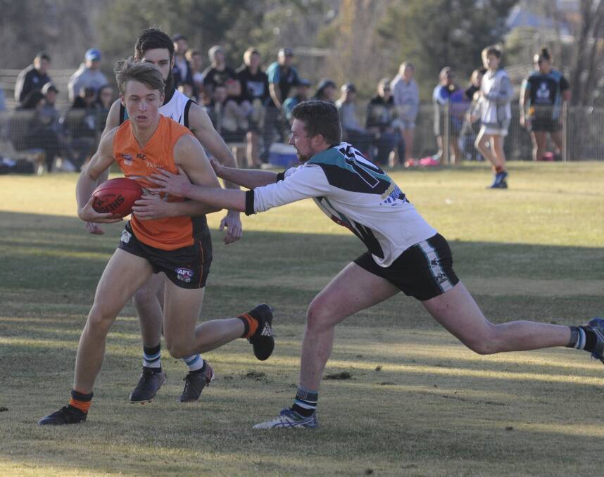 EXTRA MAN: Bathurst Giants player Mitchell Taylor on the ball, in his side's controversial defeat against Bathurst Bushrangers Rebels on Saturday. 