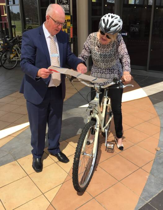 LAUNCHED: Bathurst mayor Graeme Hanger announced the official launch of Bathurst's new cycling map on Friday. He is pictured with Bathurst Regional Council destination development manager Lucy White. Photo: BRADLEY JURD