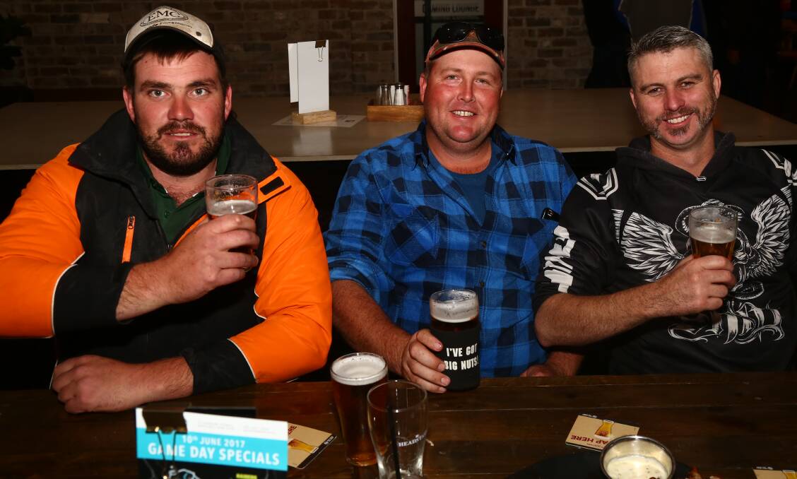 BOTTOMS UP: Luke Griffith, Rob Bailey and Luke Bourke enjoying a drink at the Panorama Motel on Saturday. 061017pbpan4