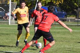 Panorama FC's Matt Hobby on the ball, with a Coniston defender in hot pursuit. Picture by Bradley Jurd