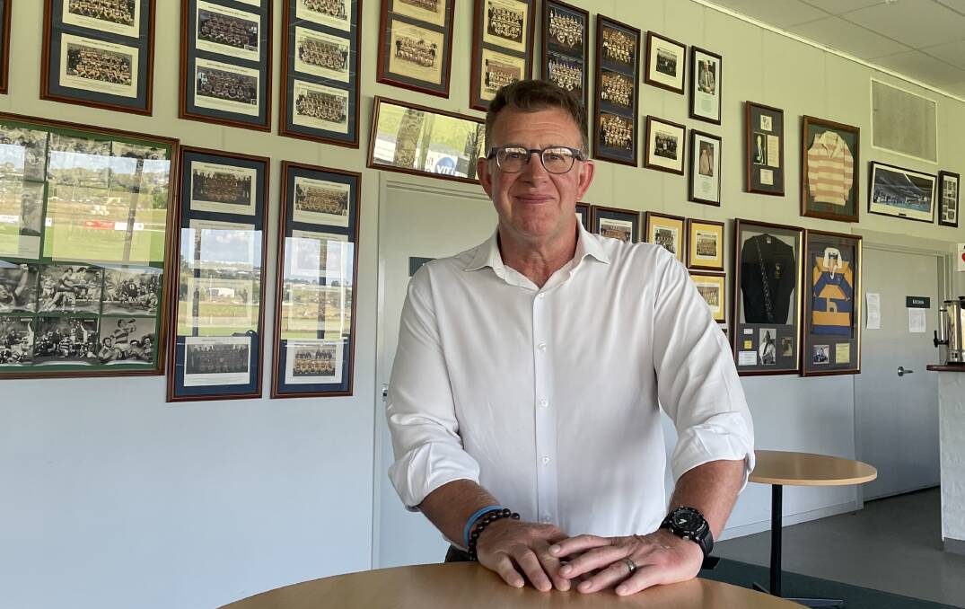 Bathurst Bulldogs president Phill Newton, in front of a host of old team photos. Picture by Bradley Jurd
