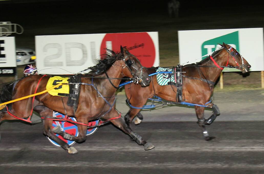 WINNER: Nathan Turnbull's Destiny Warrior (inside) pulls ahead of Satellite Village (outside) to win the Dubbo RSL Club Final on Wednesday. Photo: COFFEE PHOTOGRAPHY