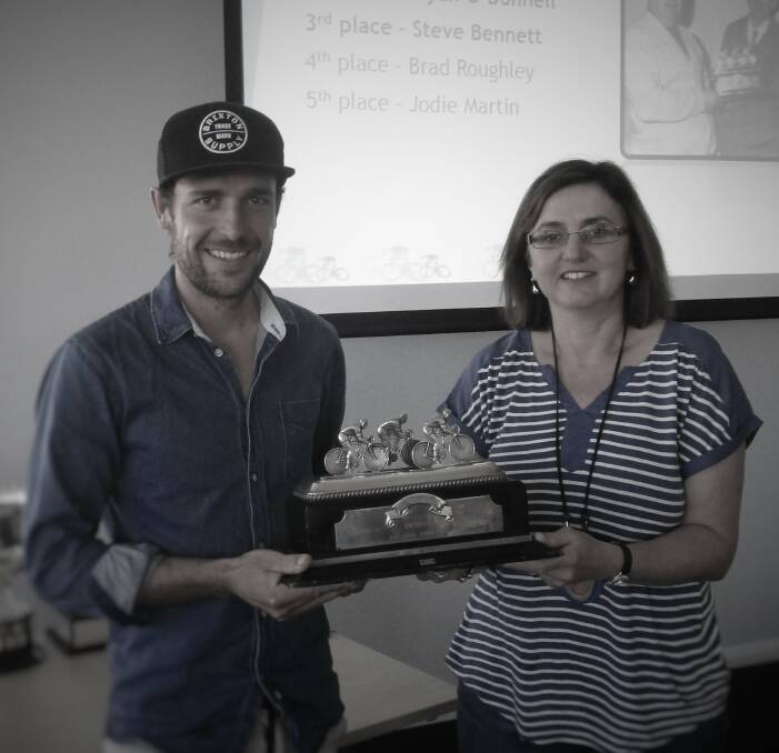 HONOURED: Dean Windsor being presented with the prestigious Weal Trophy by Janelle Kemp on Sunday. Photo: SUPPLIED 102016wealtrophy