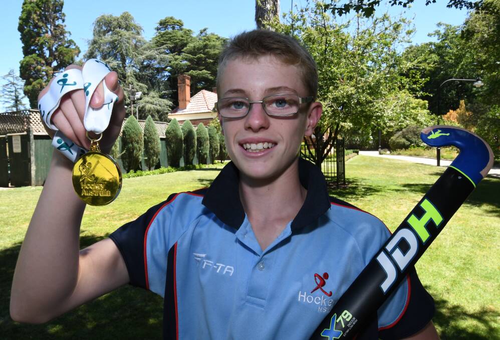 TOP GOAL SCORER: 13-year-old Fletcher Norris with his gold medal he won with NSW at the Under 13 National Indoor Hockey Championships.