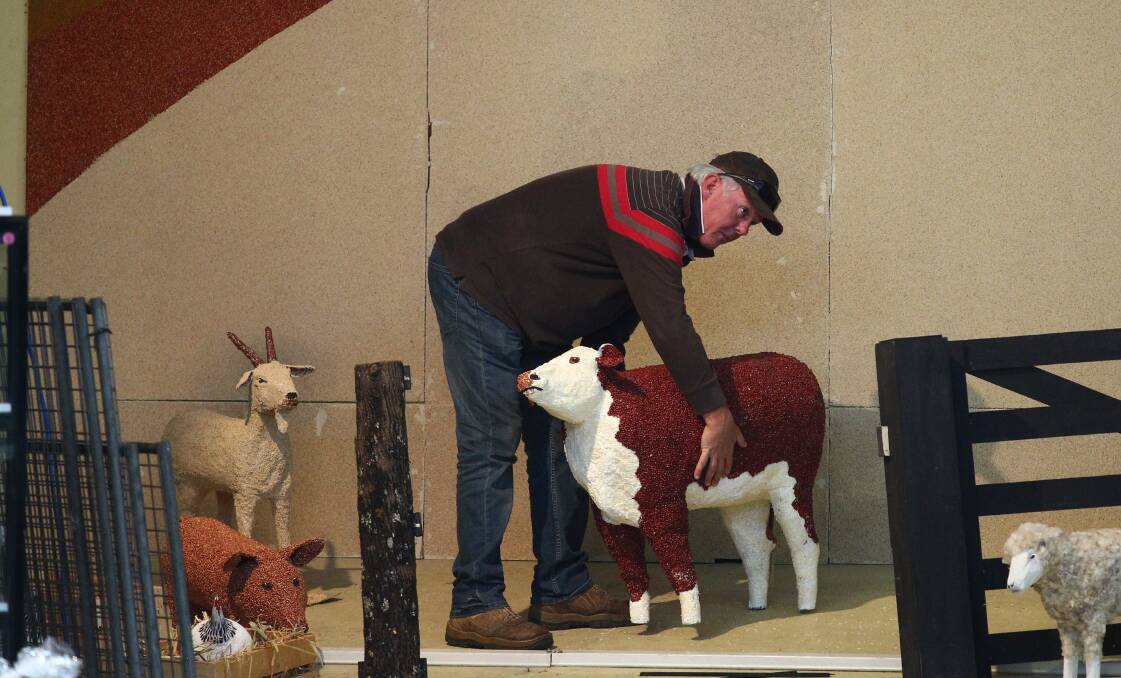 HARD WORK: Rick Hoolihan sets up the Western Districts Exhibit, in the Bathurst RSL Club Trevitt Pavilion, in time for the 149th Royal Bathurst Show. Photo: PHIL BLATCH