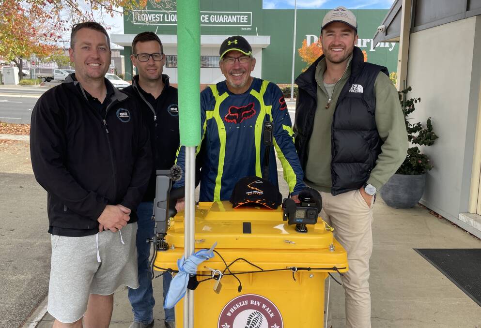 L-R: Bathurst Motor Inn owners Mitch and Dean Meredith, with Gav Kleinhans and his bin, and Bathurst deputy mayor Ben Fry. Picture by Bradley Jurd