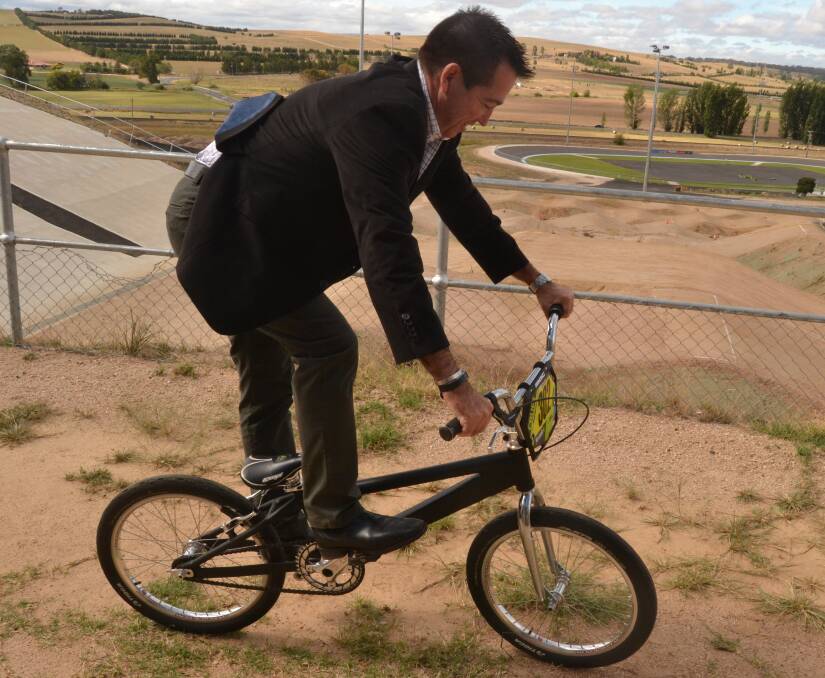 FUNDING: Member for Bathurst Paul Toole takes a ride on a BMX bike on Wednesday, at the Bathurst Bike Park. $100,000 in funding will go towards the construction of an amenities building at the park. Photo: BRADLEY JURD