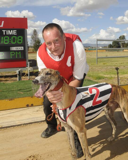 SUCCESS: Winning Grenfell trainer and owner Paul Rollins with Copper Pepper, who claimed a fourth career win from 44 starts at Kennerson Park on Monday. Photo: CHRIS SEABROOK 022717cdogs2