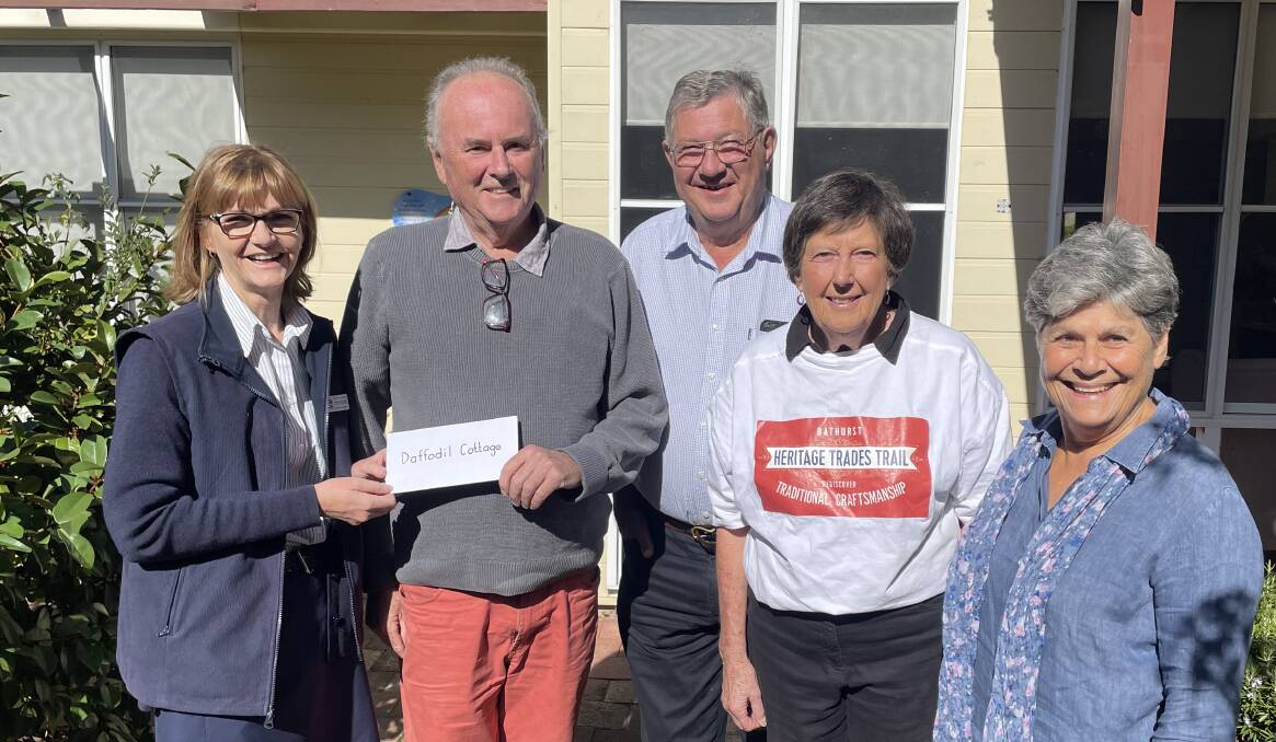 Bathurst Health Service nurse manager of cancer services Moreen Macleay, accepts a cheque from Bathurst Heritage Trades Trail committee member Sandy Bathgate, Iain McPherson, Fran White and Libby Loneragan. Picture by Bradley Jurd