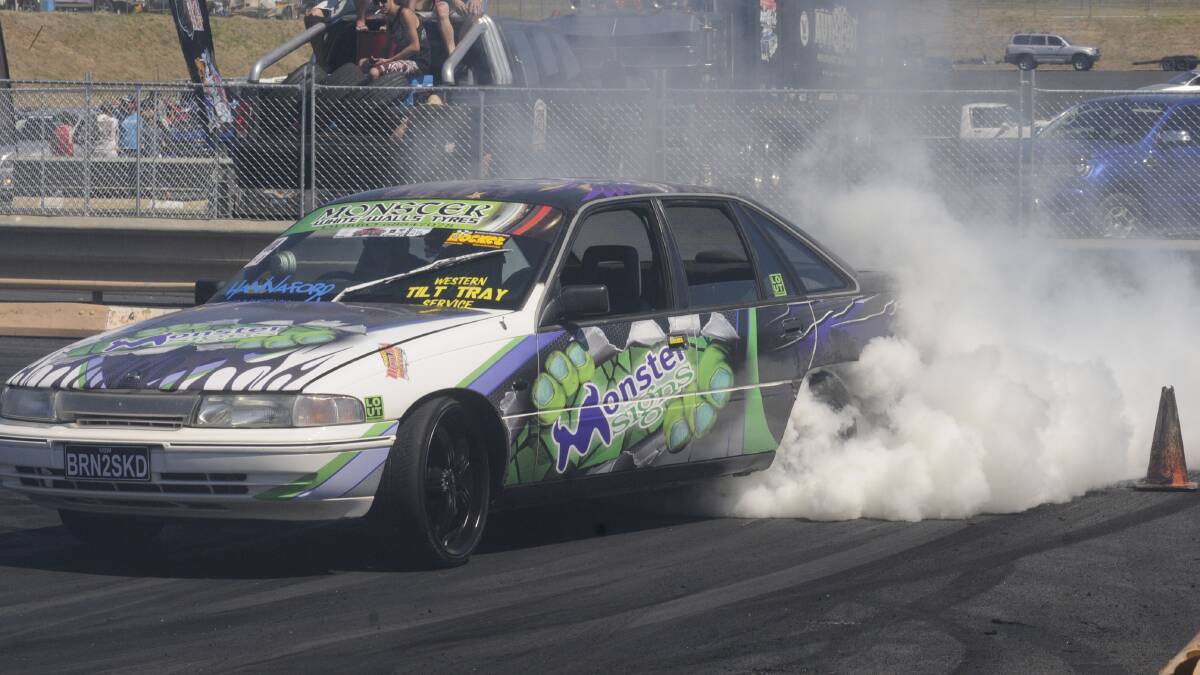 BURNOUT: One of the cars in action at the Bathurst Autofest on Sunday. The event was held in the pit lane of Mount Panorama. Photo: CHRIS SEABROOK