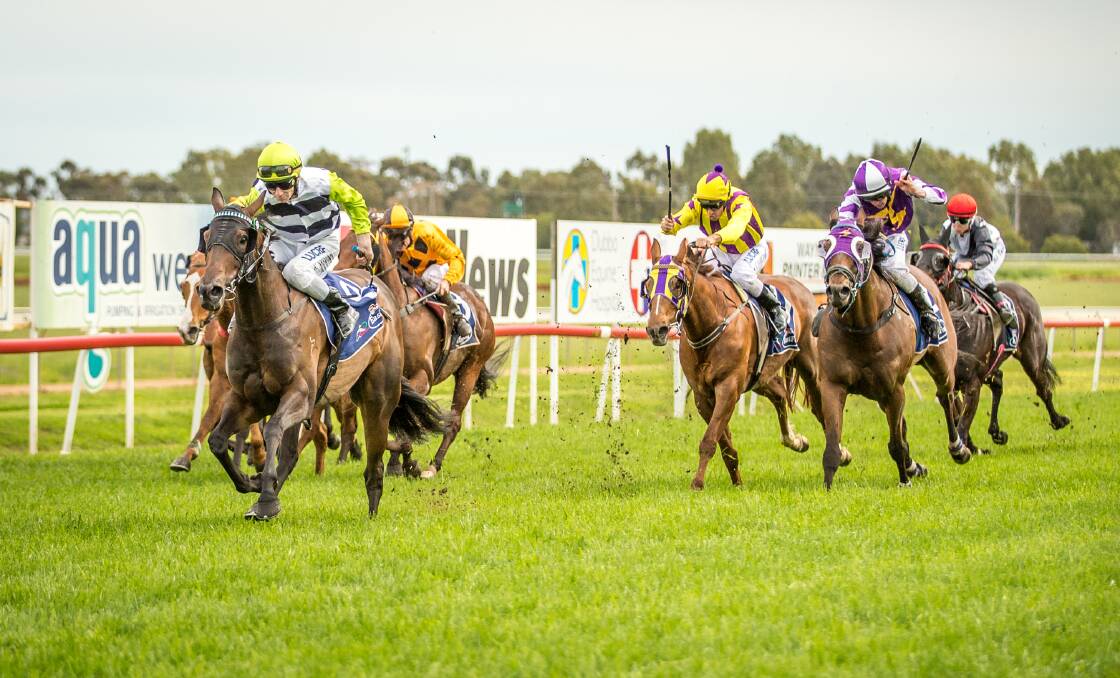 FINISH: Flying By (left, in front) comfortably wins at Teyres Park in Dubbo on Tuesday. Photo: JANIAN MCMILLAN www.racingphotography.com.au 