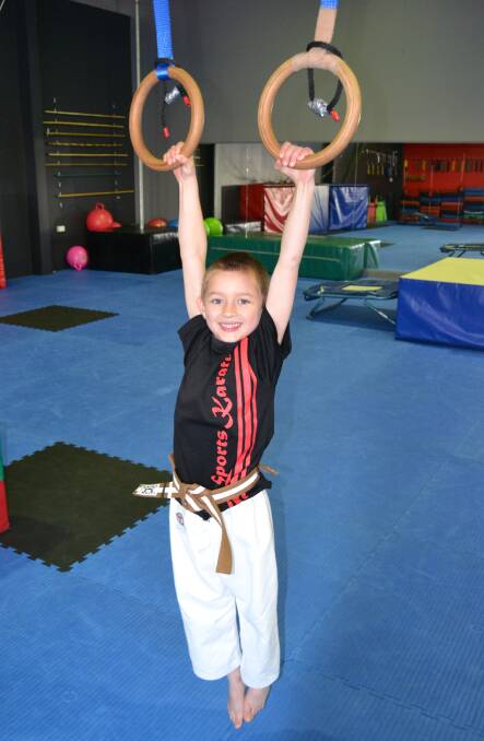 GAME ON: Seven-year-old Beau Blattman has been practising ahead of the Ninja Warrior competition at Warren Hickey's Precision Martial Arts. Photo: BRADLEY JURD 