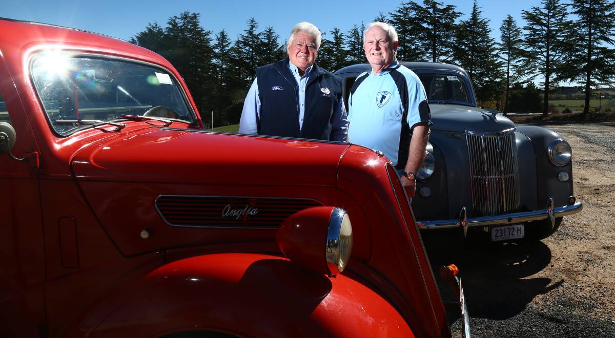VINTAGE: Lou Camenzuli and Gary Fuller, with a vintage 1949 red two-door Ford Anglia and a 1950 grey English body four-door Ford Prefect. Photo: PHIL BLATCH 051017pbford3