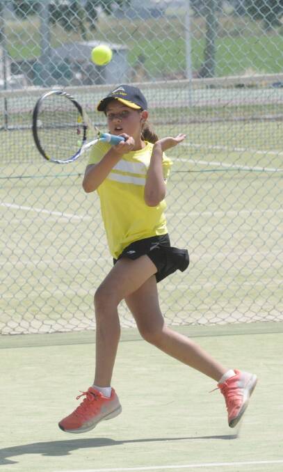 ACE SHOT: Central West squad player, Chloe Brasier (9) competing in the U10's doubles at the State Teams Tournament, Sunday. Photo:CHRIS SEABROOK 120416ctennis1