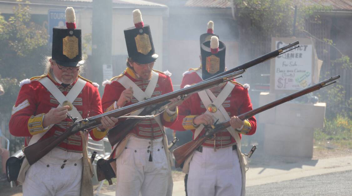 FIRE AWAY: Her Majesty's Redcoats from the 2016 Rebellion on the Turon at Sofala. This year's rebellion is being held this weekend. Photo: SUPPLIED