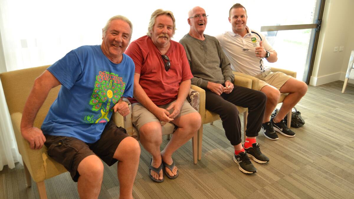 VISIT: Daryl and Allan Williams, Terry Stevens and former St George Illawarra player Dan Hunt at the Whiddon Group Kelso facility on Friday morning. Photo: BRADLEY JURD