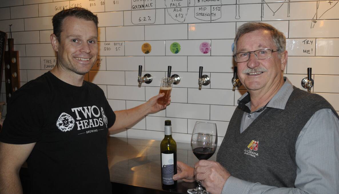CHEERS: Two Heads Brewing owner Greg Hedley and Panorama Cruise and Travel's Greg Tucker at Two Heads Brewing, ahead of this weekend's Winter Winery Wander. Photo: CHRIS SEABROOK