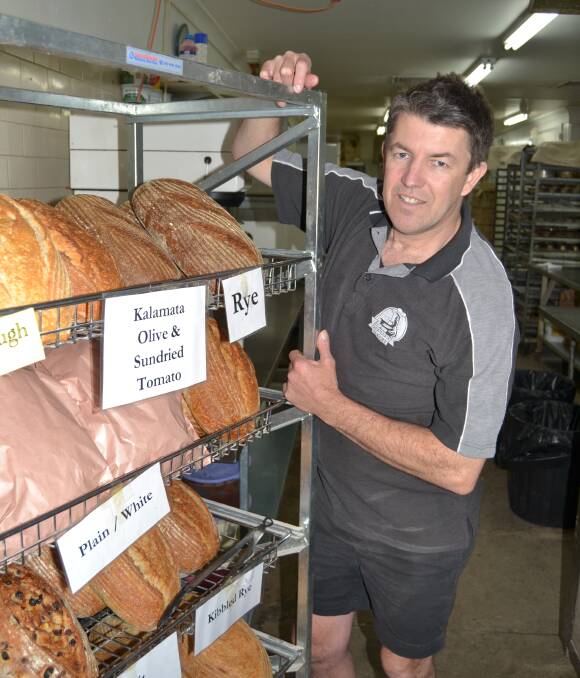 BAKER: Peewees Bakery Bathurst baker Darrin Whyms with a fresh stock of sourdough. Photo: BRADLEY JURD 0961616bjbread3