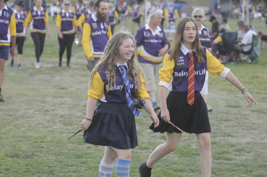 GREAT EFFORT: All Saints' College students Abby Dinger and Jade Newham (from Dumbledore's Army), dressed up in Harry Potter attire for Relay For Life. Photo:CHRIS SEABROOK 