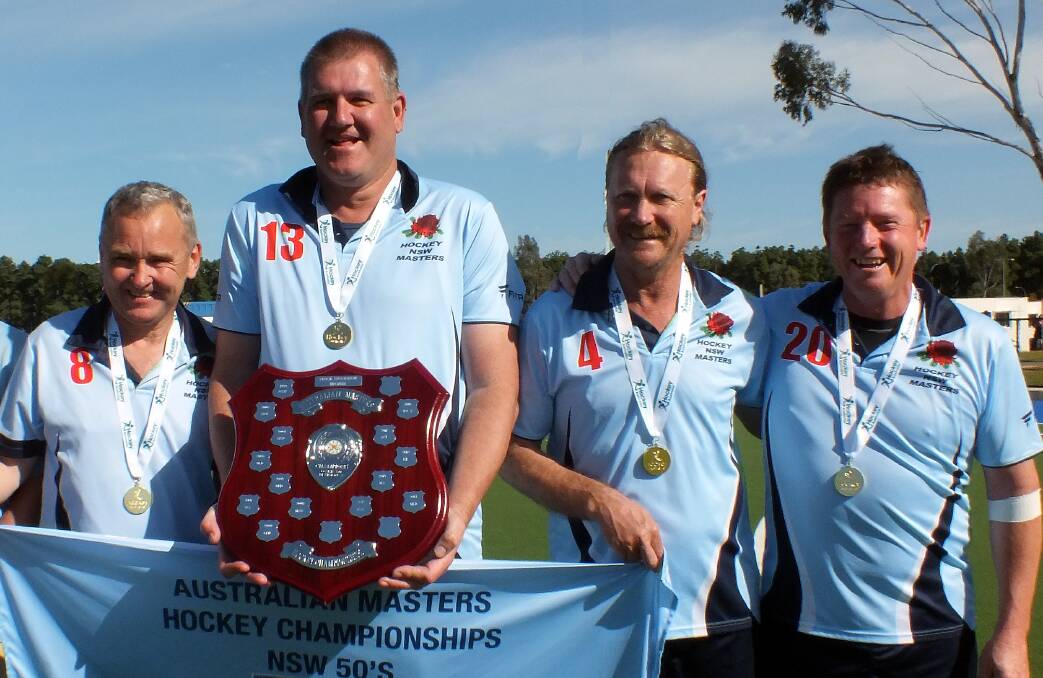 CHAMPIONS: Noel Reardon, Grahame Healey, Peter Davis and Darren Stocks after their Over-50s Division 2 gold medal victory. Photo: SUPPLIED 101916mhockey