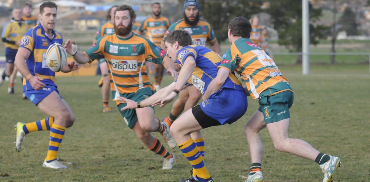 CHANGING IT UP: Justin Mobbs (pictured being tackled) is set to make the move from second to first grade, and from the backline to the second row. Photo: CHRIS SEABROOK