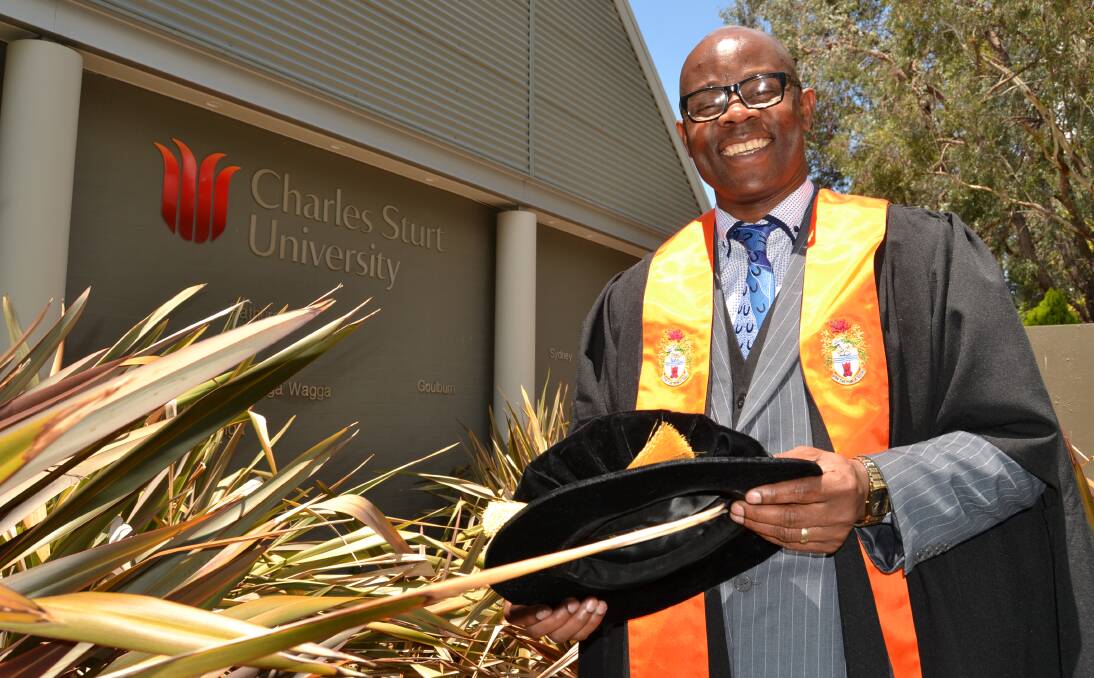 GOOD LUCK: Bathurst Charles Sturt University head of campus Chika Anyanwu is congratulating graduating students. Photo: BRADLEY JURD