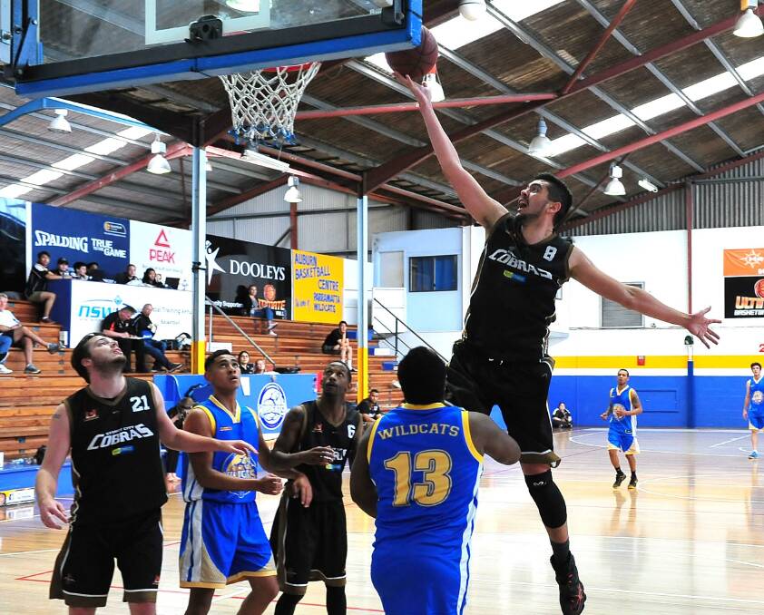 SCORE: Sam McCorkindale in action with the Sydney City Cobras, against the Parramatta Wildcats earlier in the season in the Ultimate Basketball League. Photo: NOEL ROWSELL 