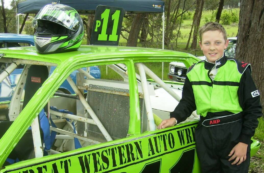 Go the Green: Young Jackson Goldie hopes to have his Corolla repaired after barrel rolling at ACT Speedway last Sunday. Luckily all of the young drivers escaped uninjured.