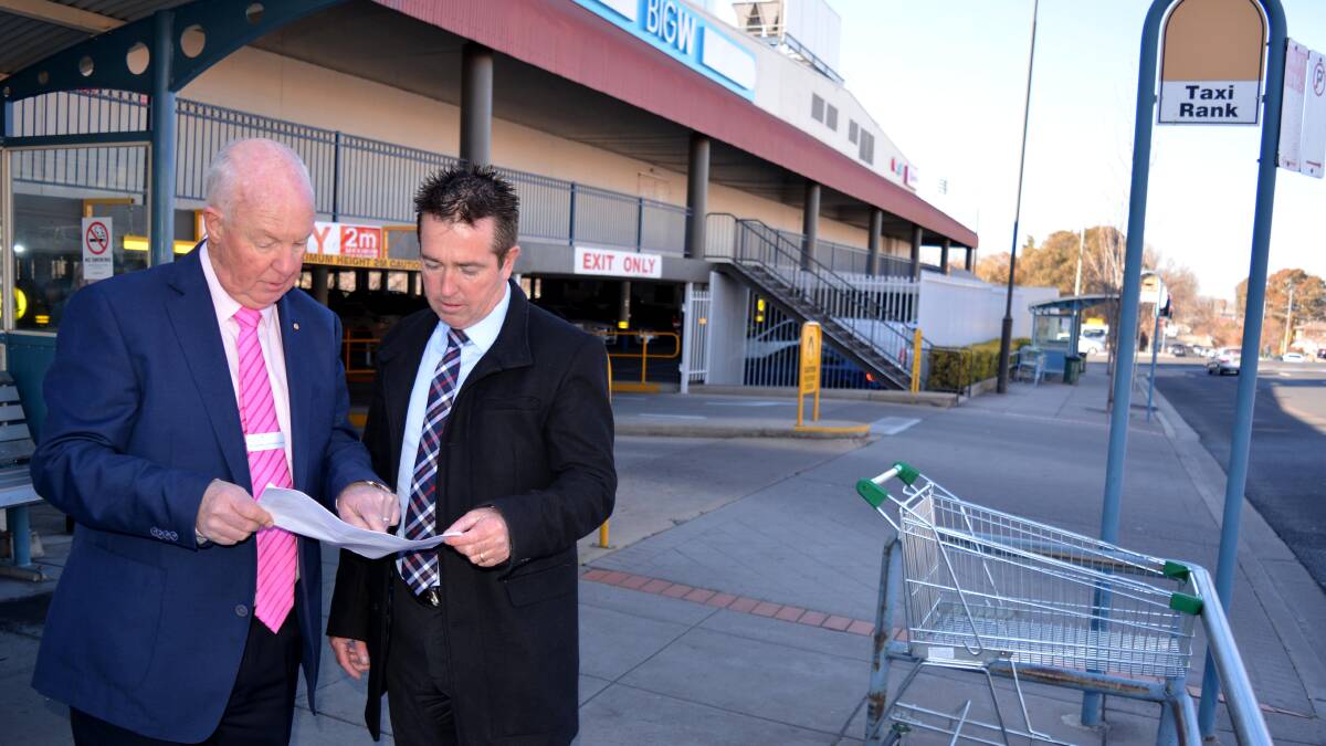 ENHANCEMENTS: Mayor Graeme Hanger and Member for Bathurst Paul Toole at the taxi rank in Howick Street, which is set to be improved.