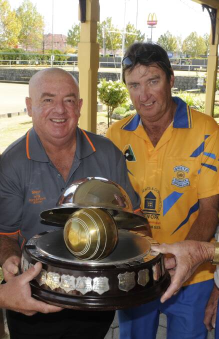 Flash Back: Steven Carr and and Gary Farrell being presented with the ANZAC Triples. Photo: 042416cbowls.