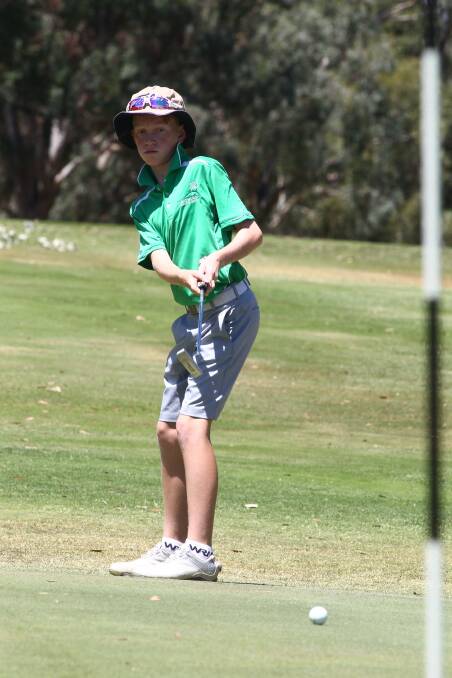 Never too Young: Cameron Jackson puts at Bathurst golf club.