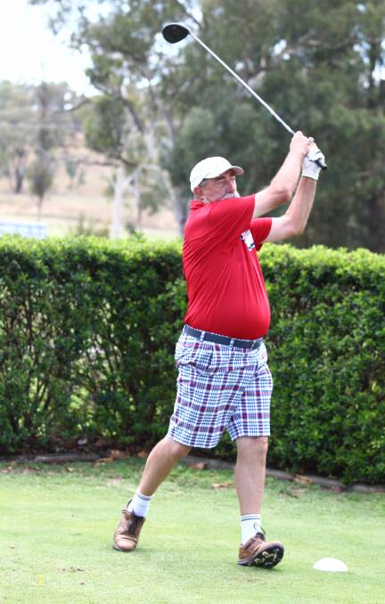 OFF AND AWAY: Andre Schuster launches a drive at the Bathurst Golf Club on Saturday. Photo: PHIL BLATCH.