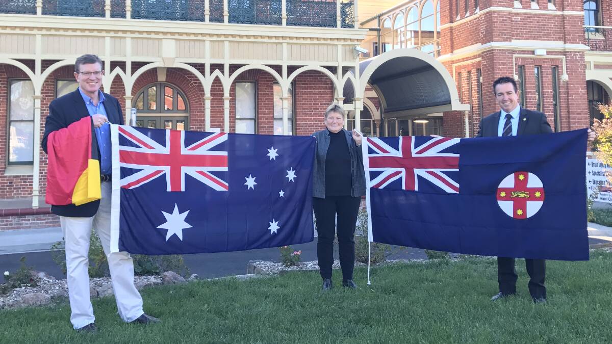 NATIONAL SPIRIT: Member for Calare Andrew Gee, Bathurst Hospital general manager Sue Patterson and Member for Bathurst Paul Toole at the flag presentation. 