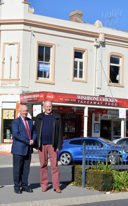 CHANGING CBD: Mayor Graeme Hanger with Sandy Bathgate of the Bathurst Heritage Network in front of the repainted Wishbone Chicken building.