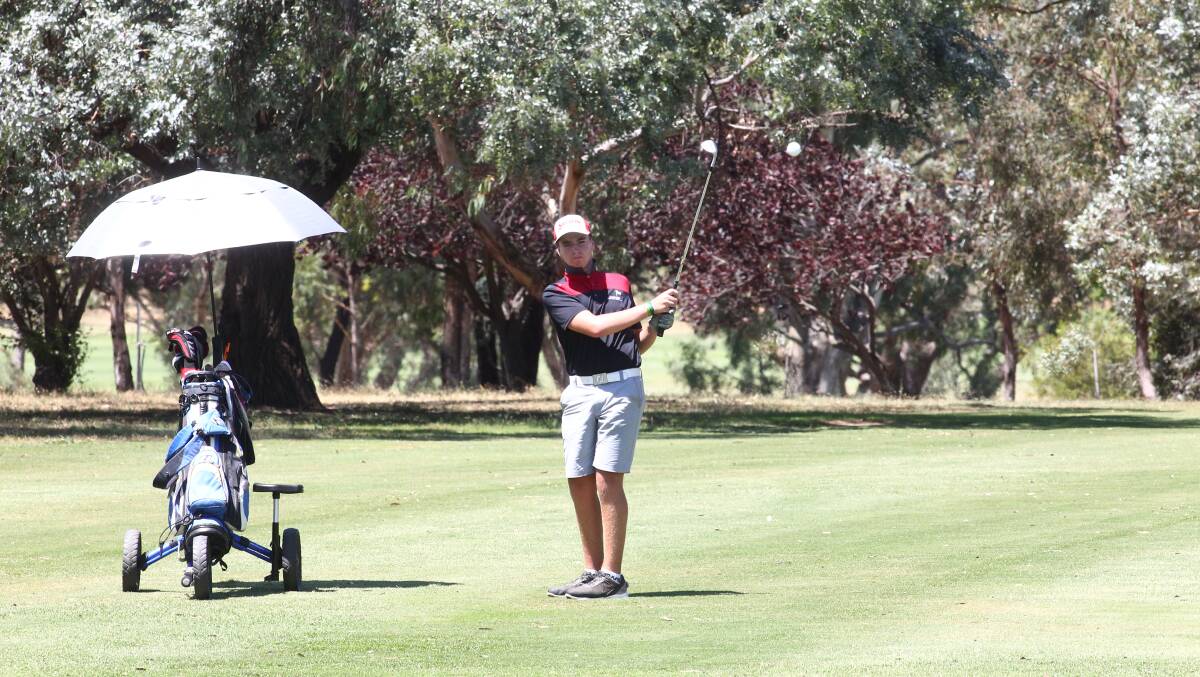 Hot Shot: Ben Mackey plays onto the green, Bathurst golf club. The extreme heat conditions on Saturday didn’t deter a healthy crowd of 131 players.