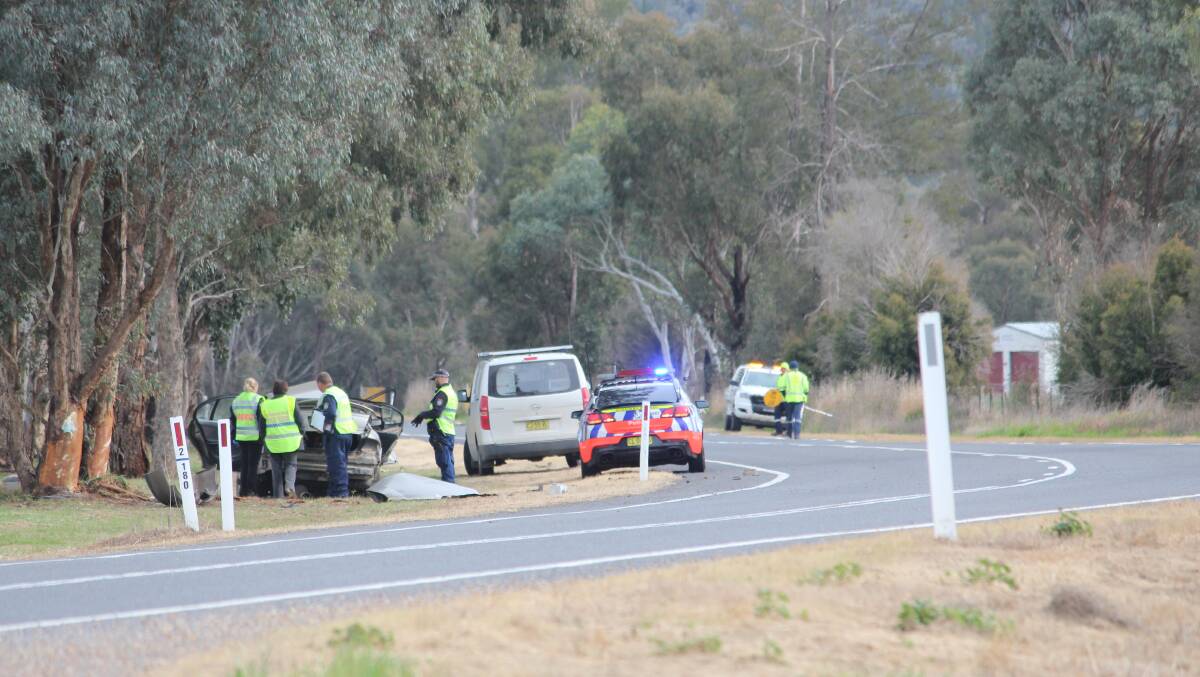 Detectives from Canobolas Local Area Command at the scene of the fatal crash on the Lachlan Valley Road on Friday morning.
