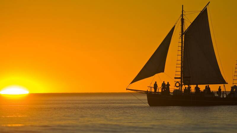 Pearl lugger at sunset off Cable Beach, Broome