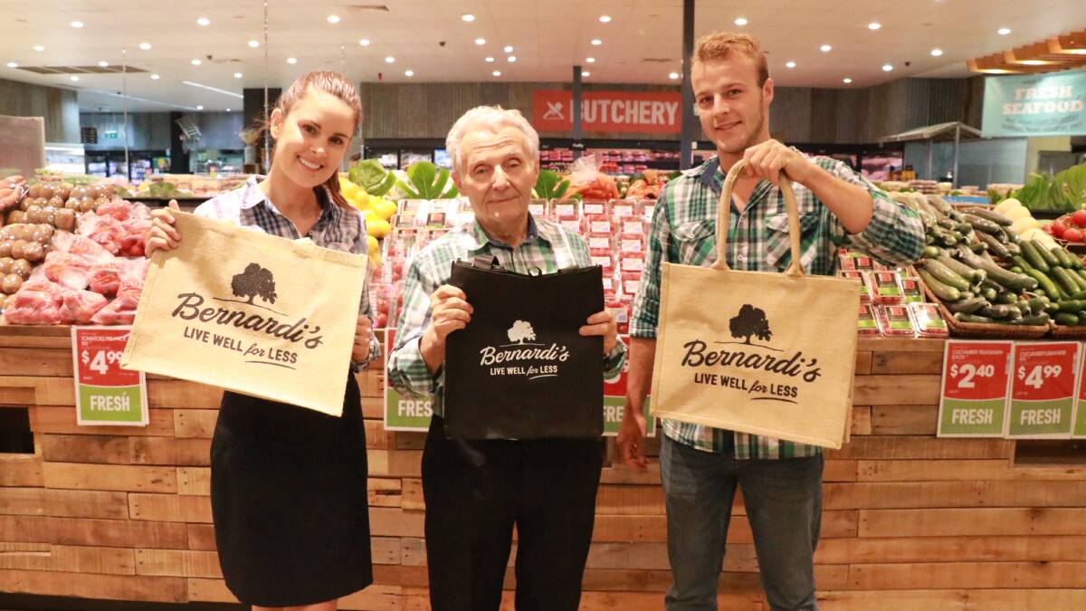 SUSTAINABLE: Sarah Davies, Tony Bernardi and Marty Bernardi with some of the branded bag options that will be available for customers from next month. 