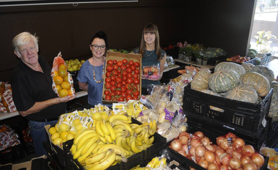 FOOD FOR THOUGHT: Garry Drew, club manager Rebecca Mathie and Emma Hazleton from the Bathurst City Community Club with fresh produce donated by Aldi for the club's Food Bank. Photo: CHRIS SEABROOK 032917caldi