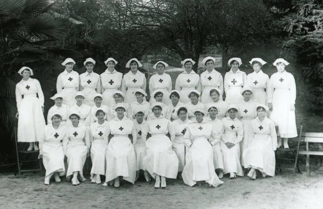 HERE TO HELP: Voluntary Aid Detachment (VAD) women posing for the photographer in Machattie Park in August 1918. The women did the job at their own expense.