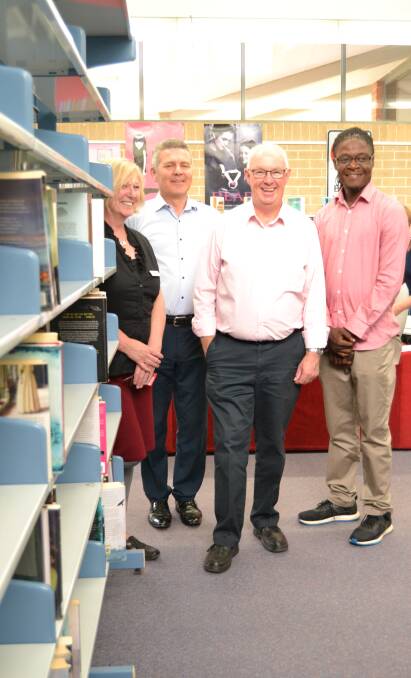 HAPPY TO HELP: Bathurst Library manager Patou Clerc, Abax Kingfisher managing director Damian Moore, mayor Graeme Hanger and Mikhail Kallon from the Madiba Project. Material from the library will be donated to the west African country Sierra Leone. 122117library
