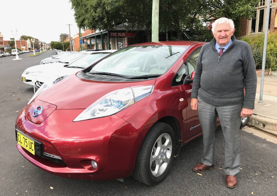 AUTUMN LEAF: Bathurst Community Climate Action Network member Lindsay Cox with his Nissan Leaf, which offers a quiet and emission-free ride.