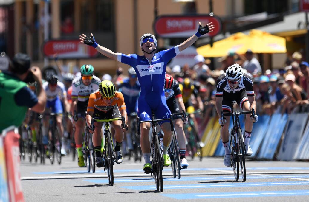 ELATION: Italian rider Elia Viviani of team Quick-Step celebrates winning stage three of the Tour Down Under. Photo: AAP/DAN PELED