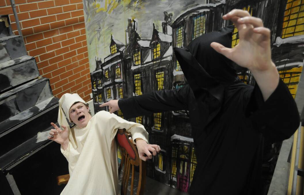 HORROR: Ryan Dury and Adam Booth prepare for the production of A Christmas Carol, which will be performed by students of St Stanislaus' College and MacKillop College. Photo: CHRIS SEABROOK 092116creaper1
