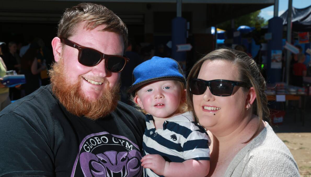 FAMILY: Joe, Louis and Bec Robinson were part of the crowd at the Kelso Public School Fete. 120316pbkelso3