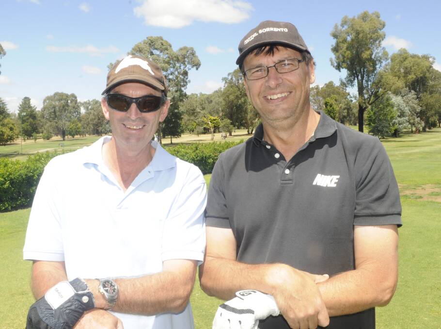 HAVING A HIT: Garry McManus and Mal Robins took part in the golf day. 022617clegacy8