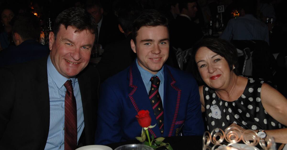 FAMILY: Patrick O'Shea and his late wife Michelle Hanrahan with their son Connor at his year 12 graduation. Mr O'Shea will walk through the Central Tablelands as a way to remember his wife.